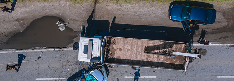 Aerial view of severe trucking accident on highway - Law Offices of Daniel L. Clayton